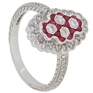 A modern, 18ct white gold, ruby & diamond set cluster ring.