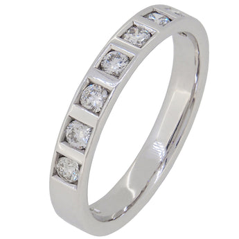 A modern, 9ct white gold, diamond set, seven stone half eternity ring.