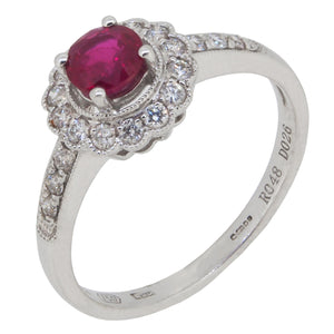 A modern, 18ct white gold, ruby & diamond set cluster ring with diamond set shoulders