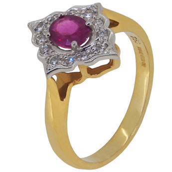 A modern, 18ct yellow & white gold, ruby & diamond set cluster ring.