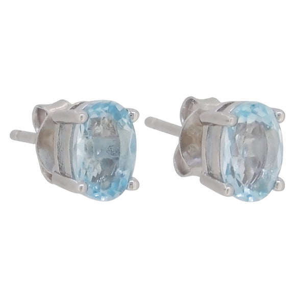 A pair of modern, silver, blue topaz set, oval stud earrings
