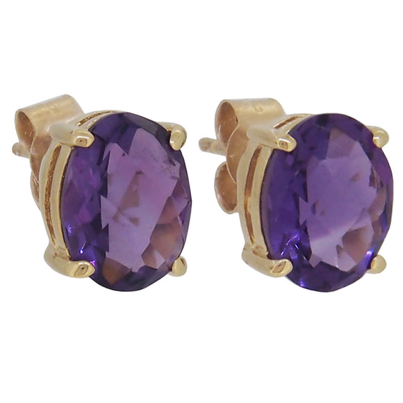 A pair of modern, 9ct yellow gold, amethyst set stud earrings