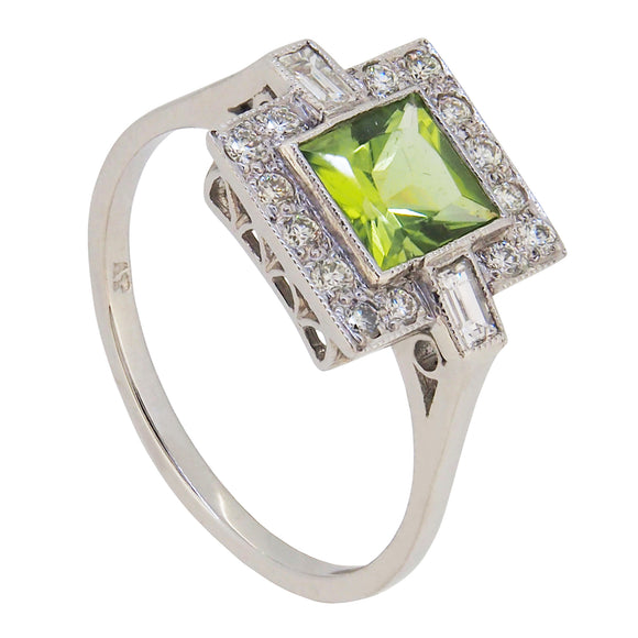 A modern, platinum, peridot & diamond set, square, Art Deco style cluster ring