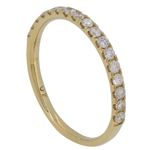 A modern, 18ct yellow gold, diamond set half eternity ring.