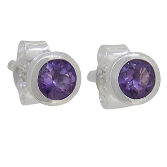 A pair of modern, silver, amethyst set stud earrings.