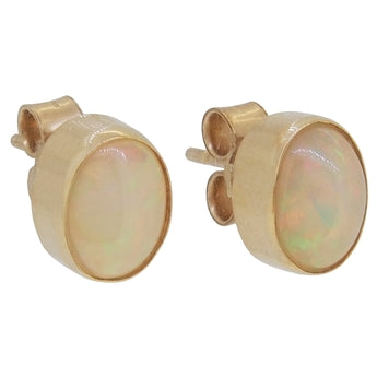 A pair of modern, 9ct yellow gold, opal set stud earrings.