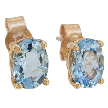 A pair of modern, 9ct yellow gold, aquamarine set single stone stud earrings.