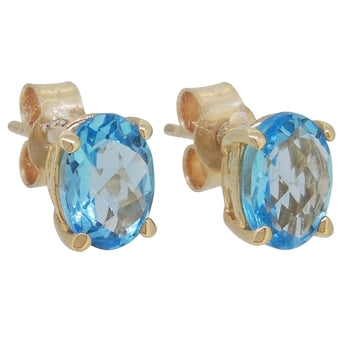A pair of modern, 9ct yellow gold, blue topaz set stud earrings.