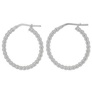 A pair of modern, silver, bead hoop earrings.