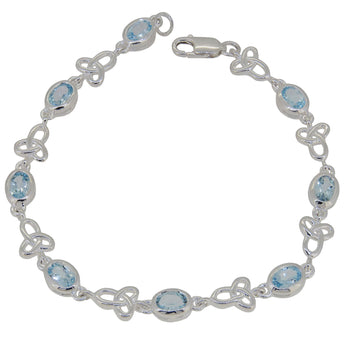 A modern, silver, blue topaz set, celtic link bracelet.