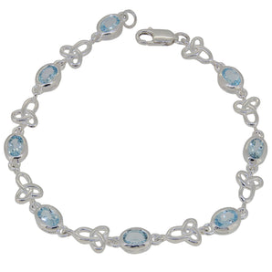 A modern, silver, blue topaz set, celtic link bracelet.