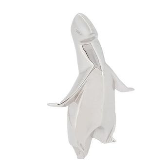 A modern, silver, origami style model of a penguin.