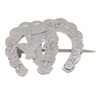 A Victorian, silver, floral, double horseshoe brooch with floral decoration