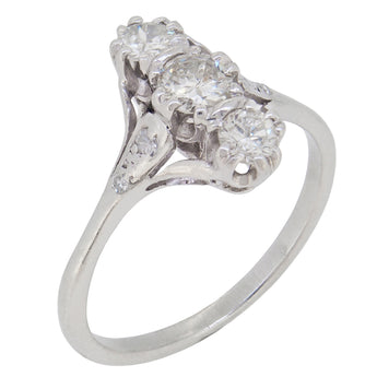 A mid-20th century, 18ct white gold, diamond set three stone ring.