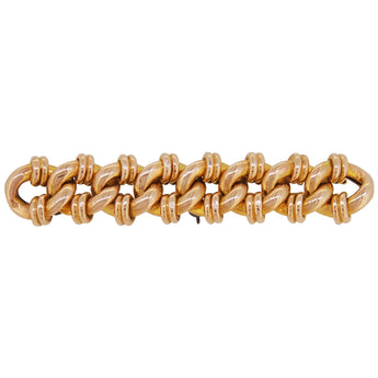 An early 20th century, 15ct yellow gold, curb link bar brooch