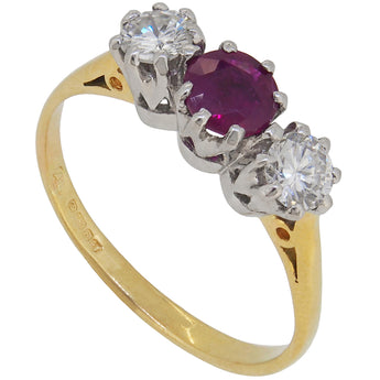 A modern, 18ct yellow & white gold, ruby & diamond set, three stone ring