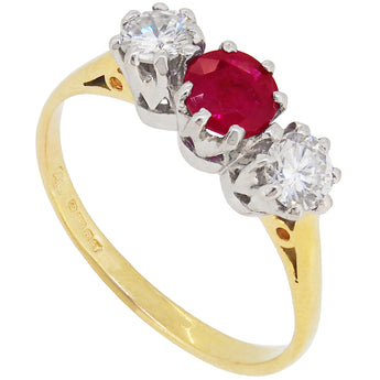 A modern, 18ct yellow & white gold, ruby & diamond set, three stone ring