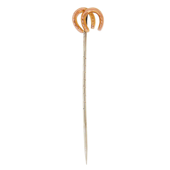An early 20th century, 9ct yellow gold, double horseshoe stick pin