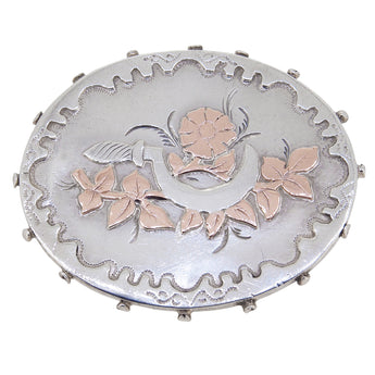 A Victorian, silver & applied gold, flower & sickle oval brooch