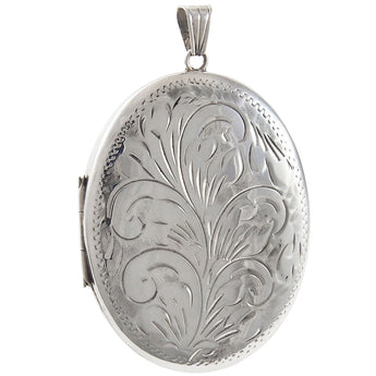 A modern, silver, engraved, oval locket