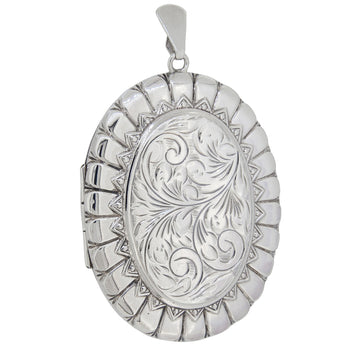A modern, silver, engraved oval locket