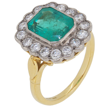 An 18ct yellow gold, emerald & diamond set cluster ring.