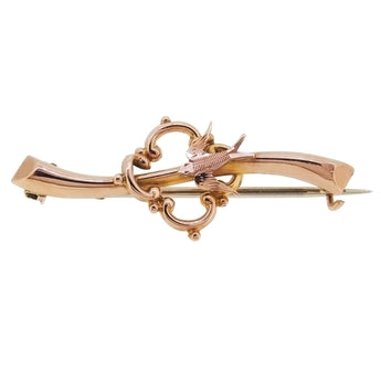 An Edwardian, yellow gold, bird bar brooch.