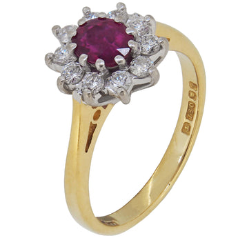 A modern, 18ct yellow & white gold, ruby & diamond set cluster ring