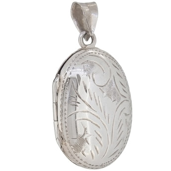 A modern, silver, engraved oval locket