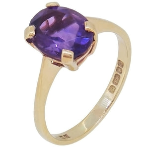 A modern, 9ct yellow gold, amethyst set, single stone ring.