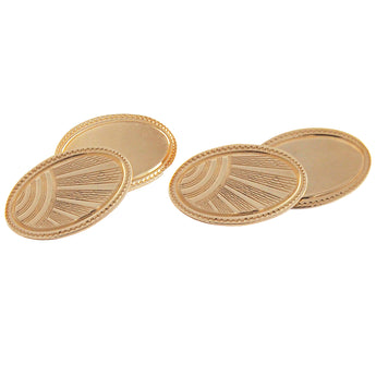 A pair of mid-20th century, 9ct yellow gold, oval, chain link cufflinks with sun ray engraving.
