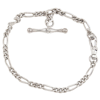 A modern, silver, curb link bracelet with T-bar fastener