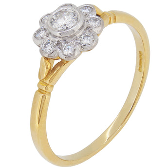 A modern, 18ct yellow & white gold, diamond set cluster ring.