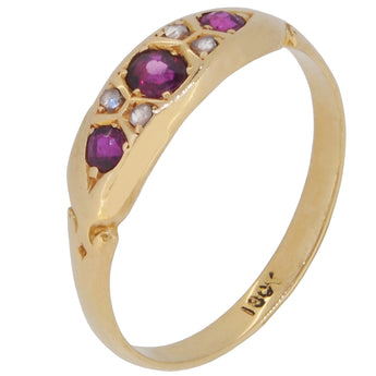 An early 20th century, 18ct yellow gold, ruby & diamond gypsy set, seven stone ring.