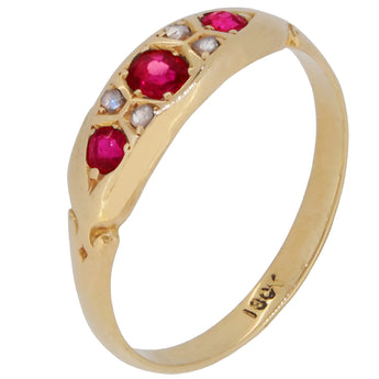 An early 20th century, 18ct yellow gold, ruby & diamond gypsy set, seven stone ring.