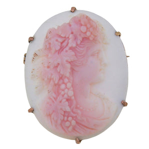 An early 20th century, 9ct yellow gold, pink cameo brooch featuring an image of Bacchus.
