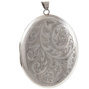 A modern, silver, engraved oval locket