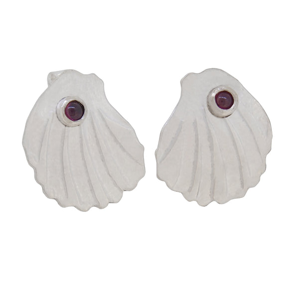 A pair of modern, silver, garnet set shell stud earrings