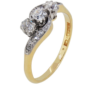 An early 20th century, 18ct yellow gold & platinum, diamond set, nine stone crossover ring.