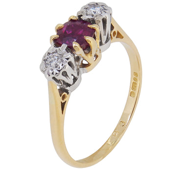 A modern, 18ct yellow gold, ruby & diamond set, three stone ring.