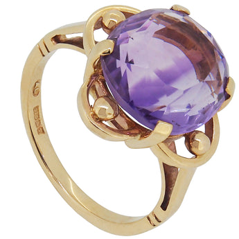 A modern, 9ct yellow gold, amethyst set, single stone ring