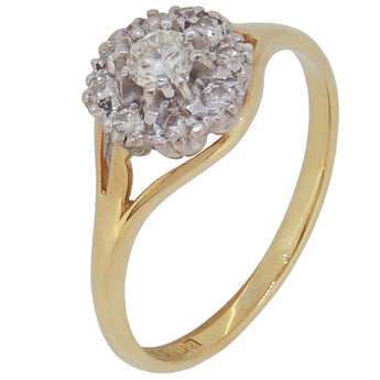 A modern, 18ct yellow gold, diamond set cluster ring.