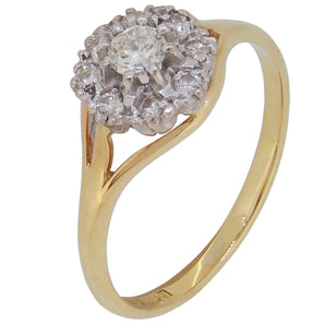 A modern, 18ct yellow gold, diamond set cluster ring.