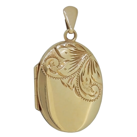 A modern, 9ct yellow gold, half engraved oval locket