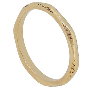 A mid-20th century, 9ct yellow gold, faceted wedding ring.