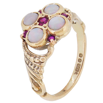 A modern, 9ct yellow gold, opal & ruby set, nine stone cluster ring.