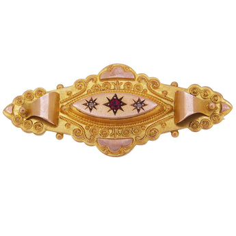An Edwardian, 9ct yellow gold, rose cut diamond & red gem set brooch.