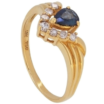 A modern, 18ct yellow gold, pear cut sapphire & diamond set, eight stone, V shaped ring.