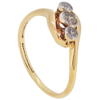 An early 20th century, 18ct yellow gold & platinum setting, diamond set, three stone crossover ring.