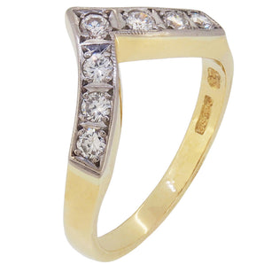 A modern, 18ct yellow gold, diamond set, seven stone, 'V' shaped half eternity ring